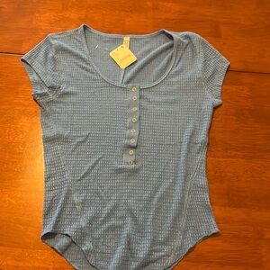 Intimately scoop neck top with short cap sleeves.